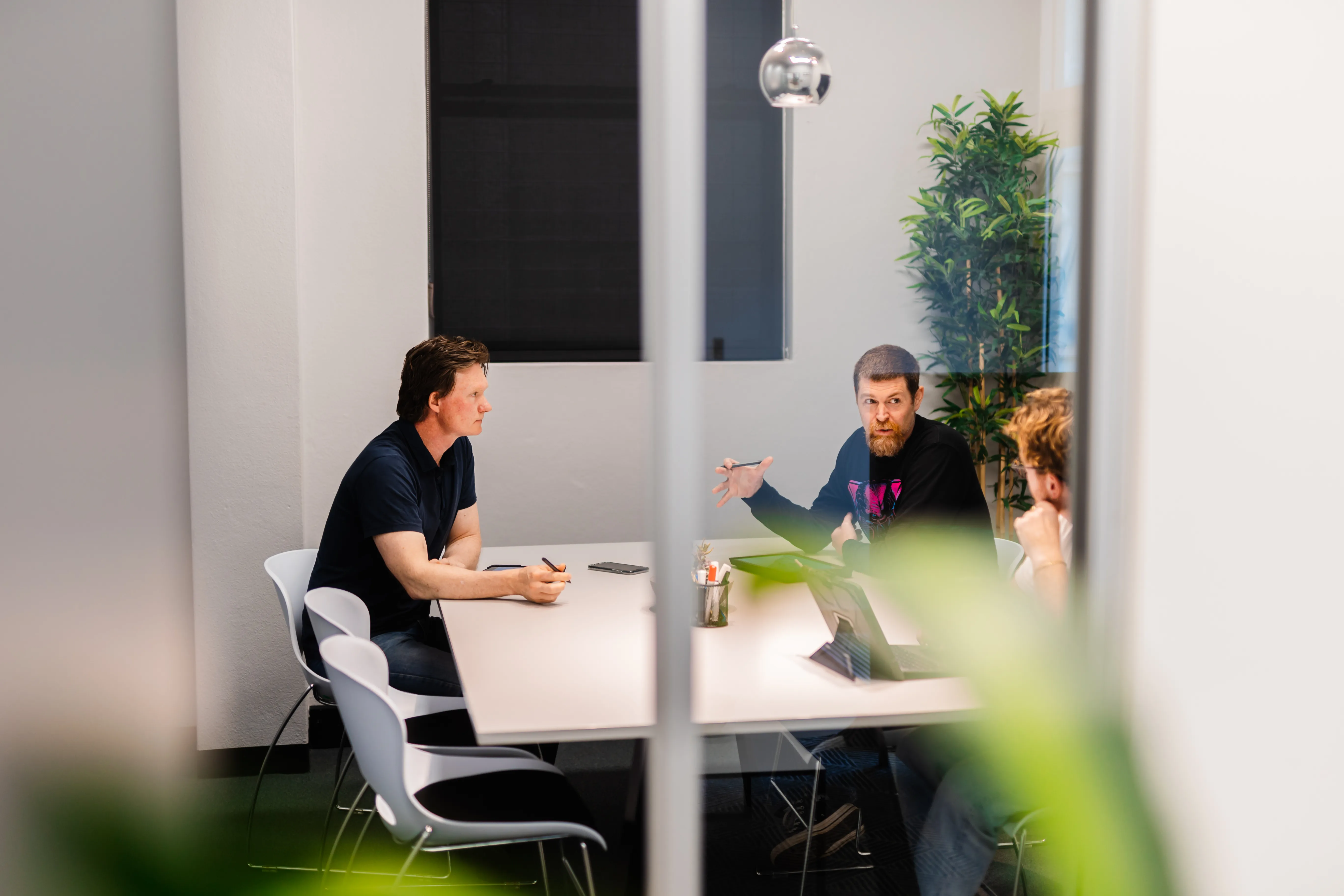 Moving Parts Productions team consulting in the office
